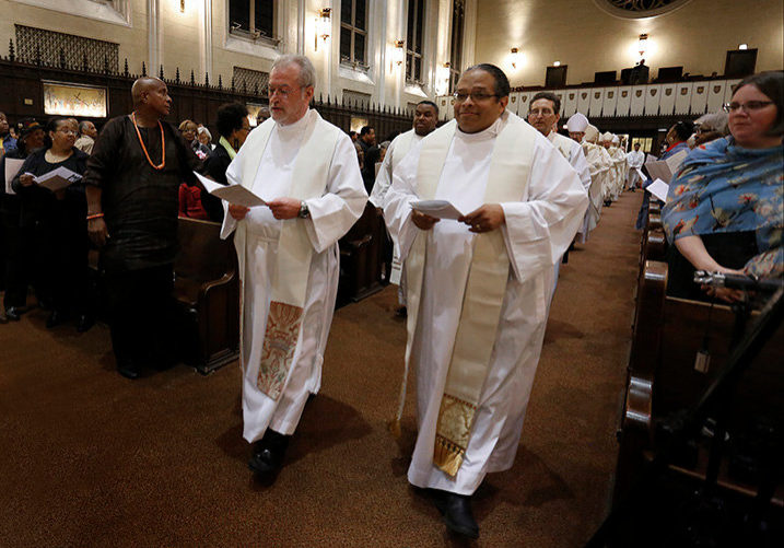 20191030 181400 Page16 Fr.Penninprocession Father Michael Penn, pastor of Holy Rosary parish in Monroe City, Missouri and Norbertine Gerard Jordan, who is helping Auxiliary Bishop Joseph N. Perry advocate on behalf of Tolton's canonization, walk in the entrance procession. Cardinal Cupich was the main celebrant at a Mass of Thanksgiving honoring Venerable Rev. Augustus Tolton on Oct. 14, 2019 at St. Philip Neri Church, 2132 E. 72nd St., Chicago. The Mass celebrated Pope Francis’ June 11, 2019 declaration of Tolton as “Venerable.” He is the first African American priest to receive this designation, a step toward possible sainthood. (Karen Callaway/Chicago Catholic)